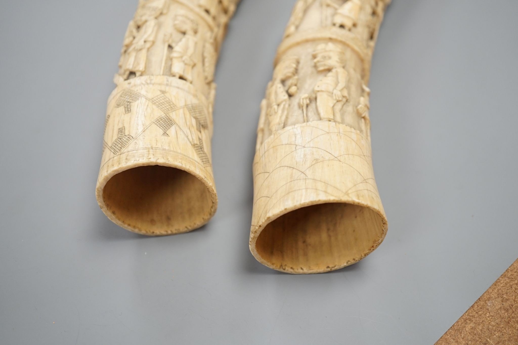 Two Loango carved ivory tusks, Republic of Congo, mid to late 19th century, 46cms long.